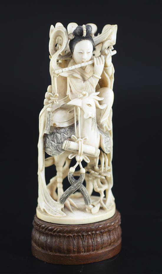A Chinese ivory figure of the goddess He Xiangu, early 20th century, 21.5cm including wood stand